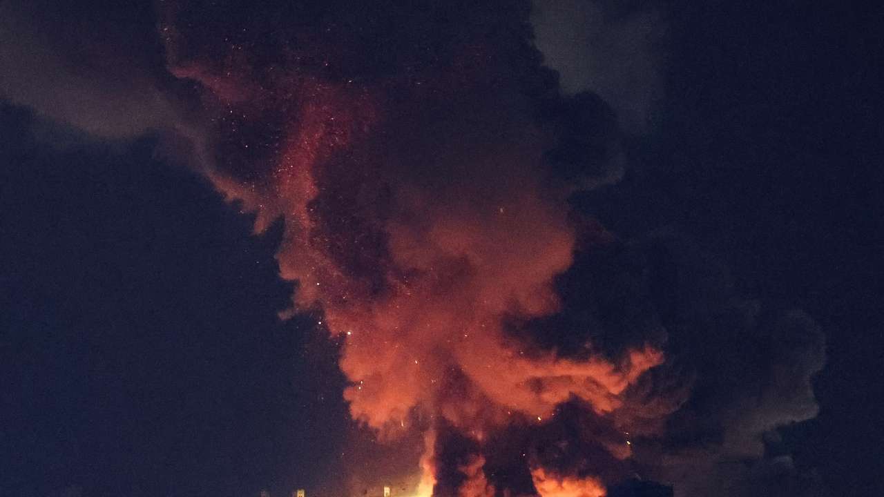 Smoke billows over Beirut's southern suburbs after a strike, amid ongoing hostilities between Hezbollah and Israeli forces