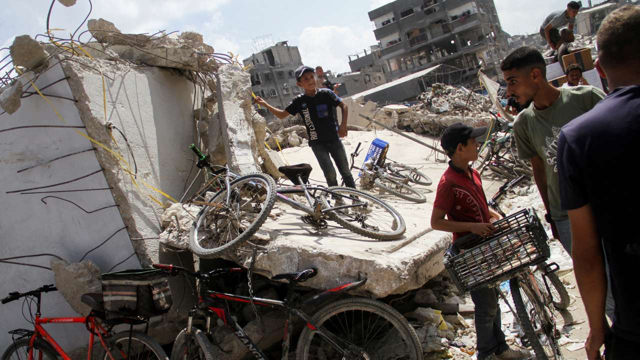 Palestinians gather to receive aid, in Jabalia, northern Gaza Strip