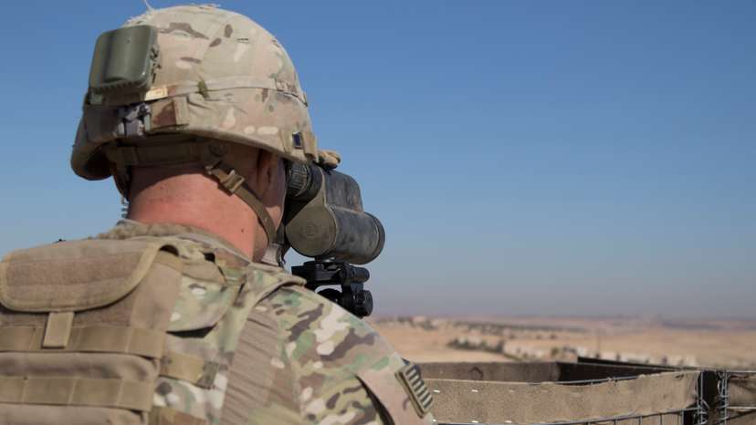 A U.S. Soldier surveils the area during a combined joint patrol in Manbij