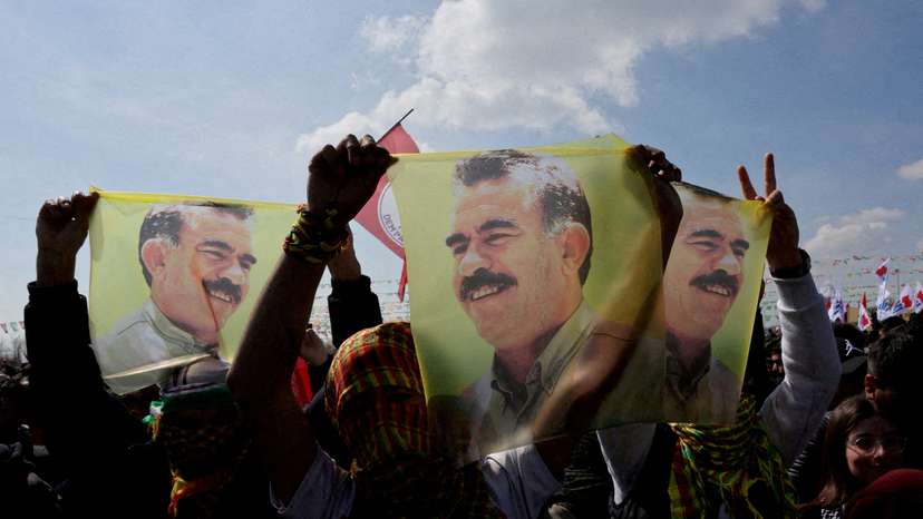 FILE PHOTO: Pro-Kurdish party supporters display flags with portrait of jailed PKK leader Abdullah Ocalan