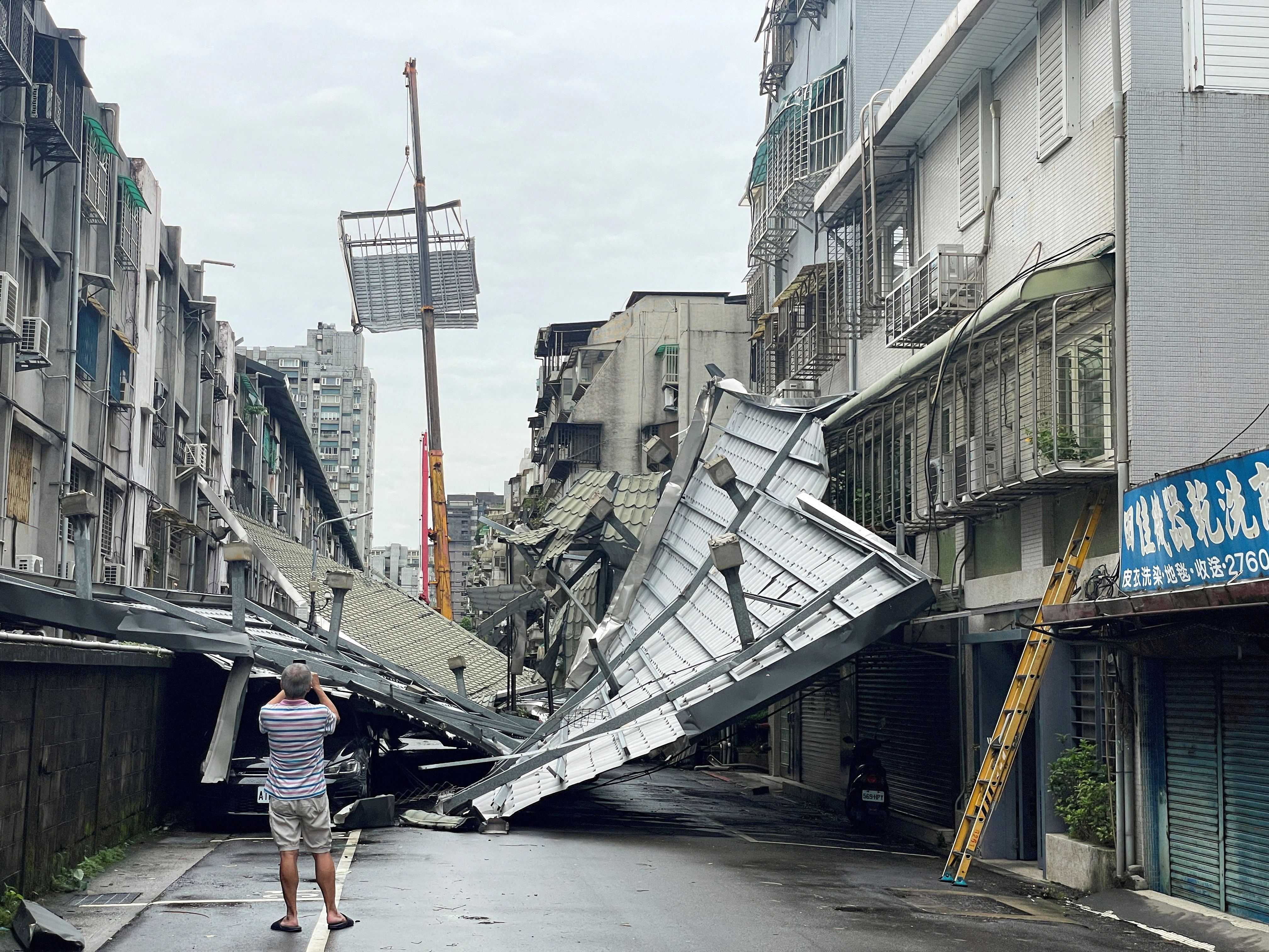 A damaged rooftop are seen after Typhoon Kong-rey hit in Taipei