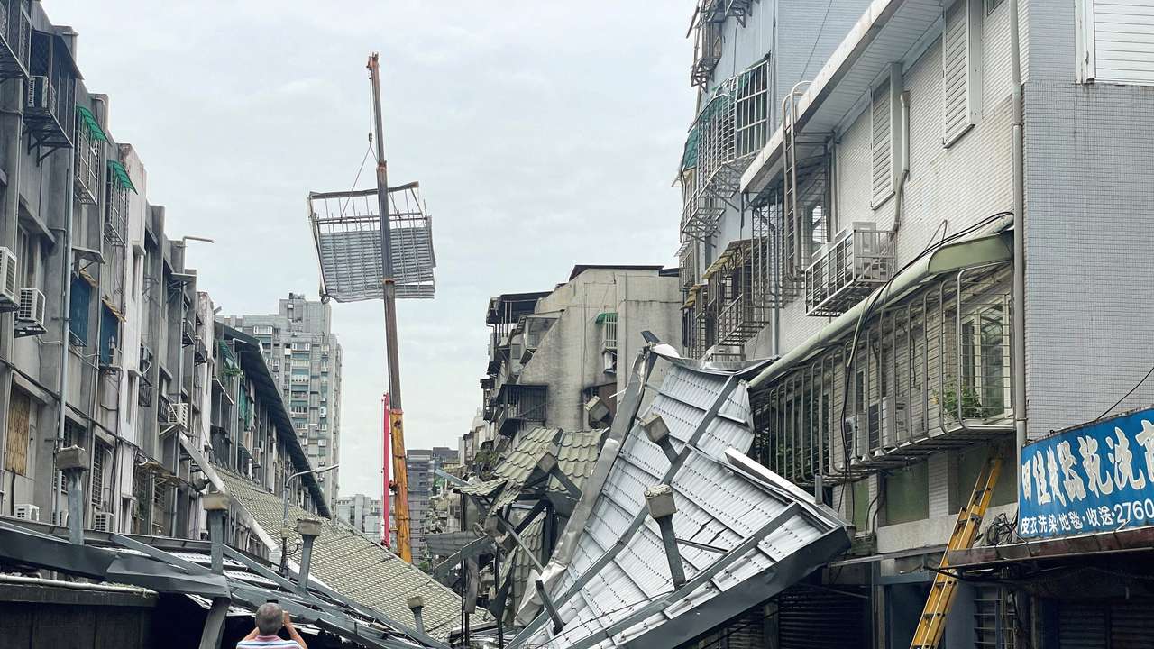 A damaged rooftop are seen after Typhoon Kong-rey hit in Taipei