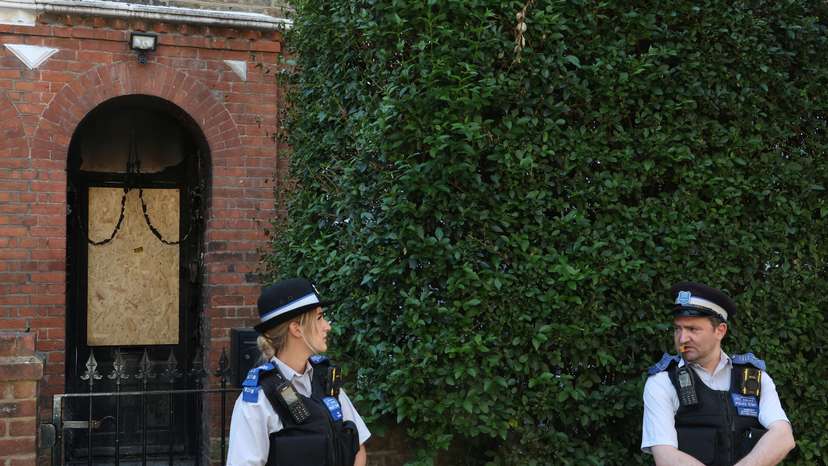 Police officers stand outside Britain's Prime Minister Starmer's home, after it was damaged by fire in suspected arson attack in north London