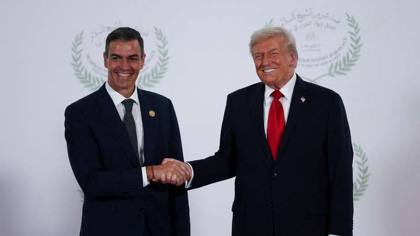 FILE PHOTO: U.S. President Donald Trump and Spanish Prime Minister Pedro Sanchez shake hands as they pose for a photo