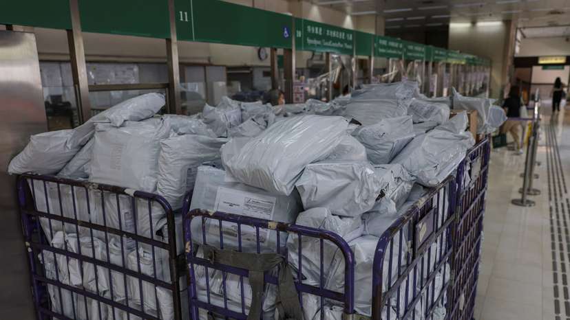 Parcels await processing at a post office as Hong Kong Post stops certain U.S.-bound shipments since April 27 due to new U.S. tariff rules, in Hong Kong