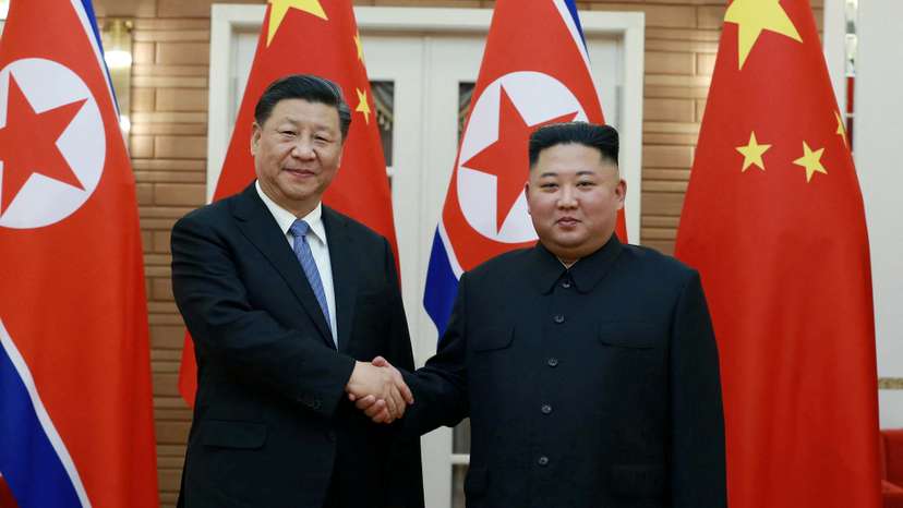 FILE PHOTO: North Korean leader Kim Jong Un shakes hands with China's President Xi Jinping during Xi's visit in Pyongyang, North Korea in this undated photo released on June 21, 2019 by North Korea's Korean Central News Agency (KCNA)