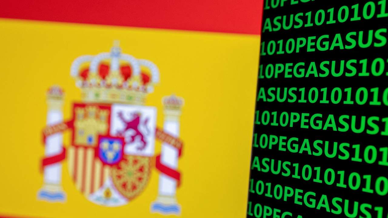 FILE PHOTO: Illustration shows word Pegasus, binary codes and Spanish flag