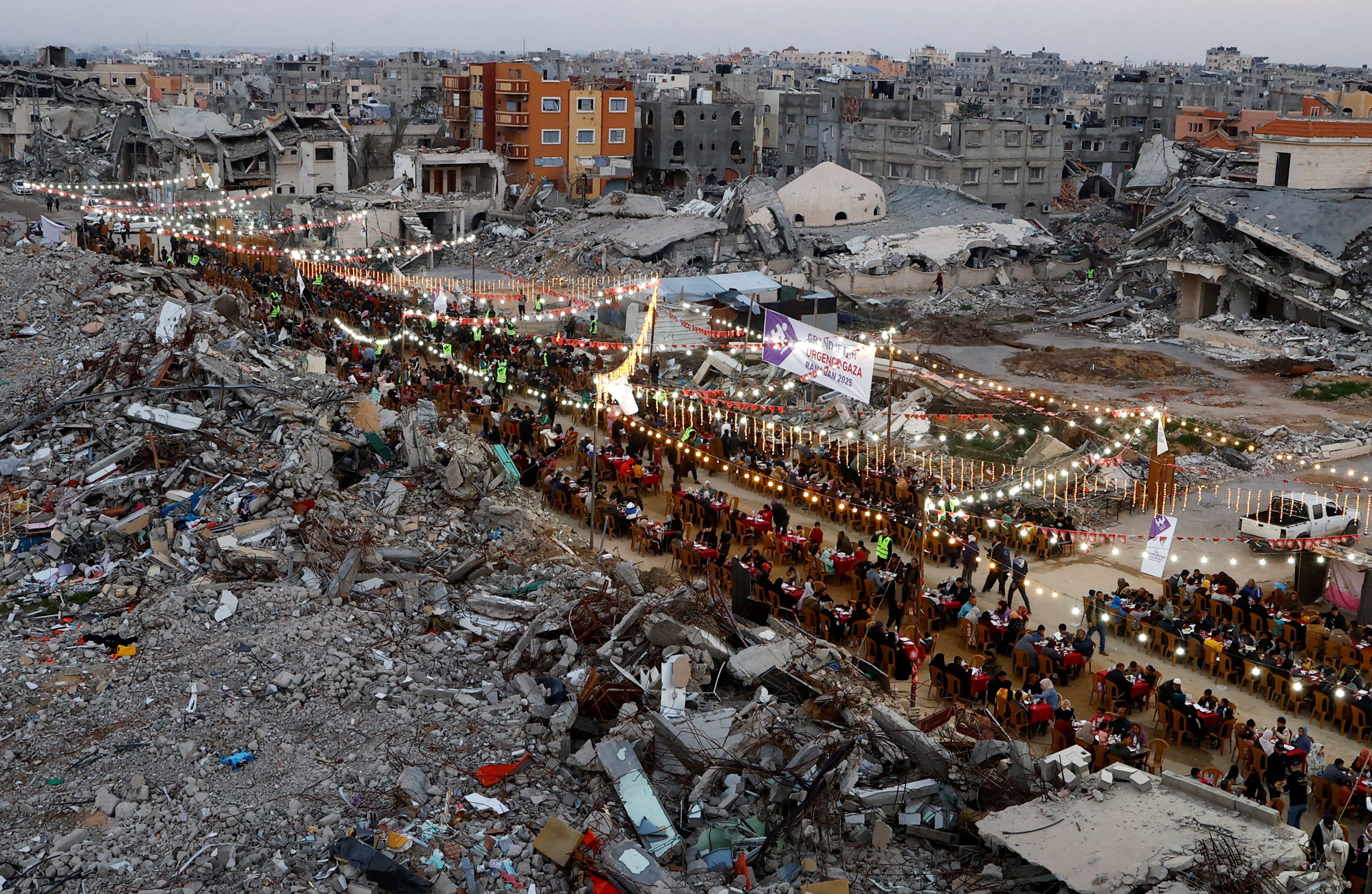 FILE PHOTO: Palestinians break their fast by eating the Iftar meals during the holy month of Ramadan