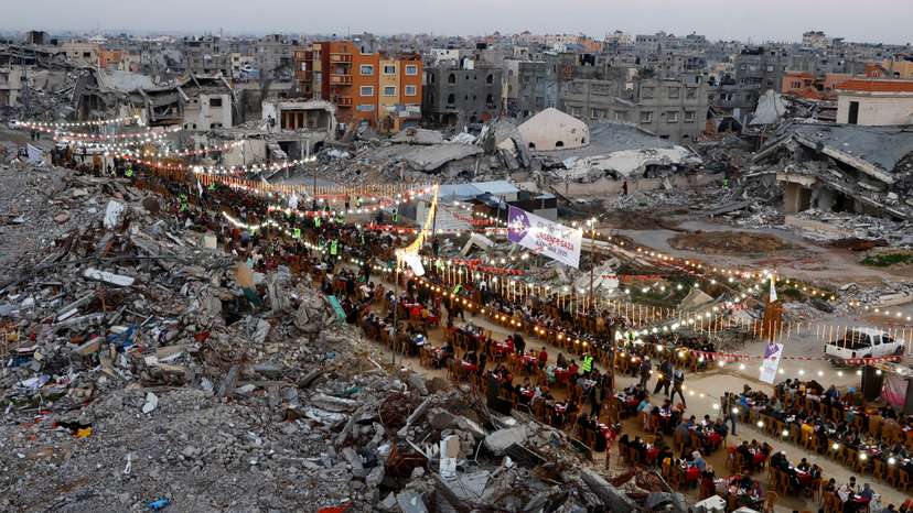 FILE PHOTO: Palestinians break their fast by eating the Iftar meals during the holy month of Ramadan