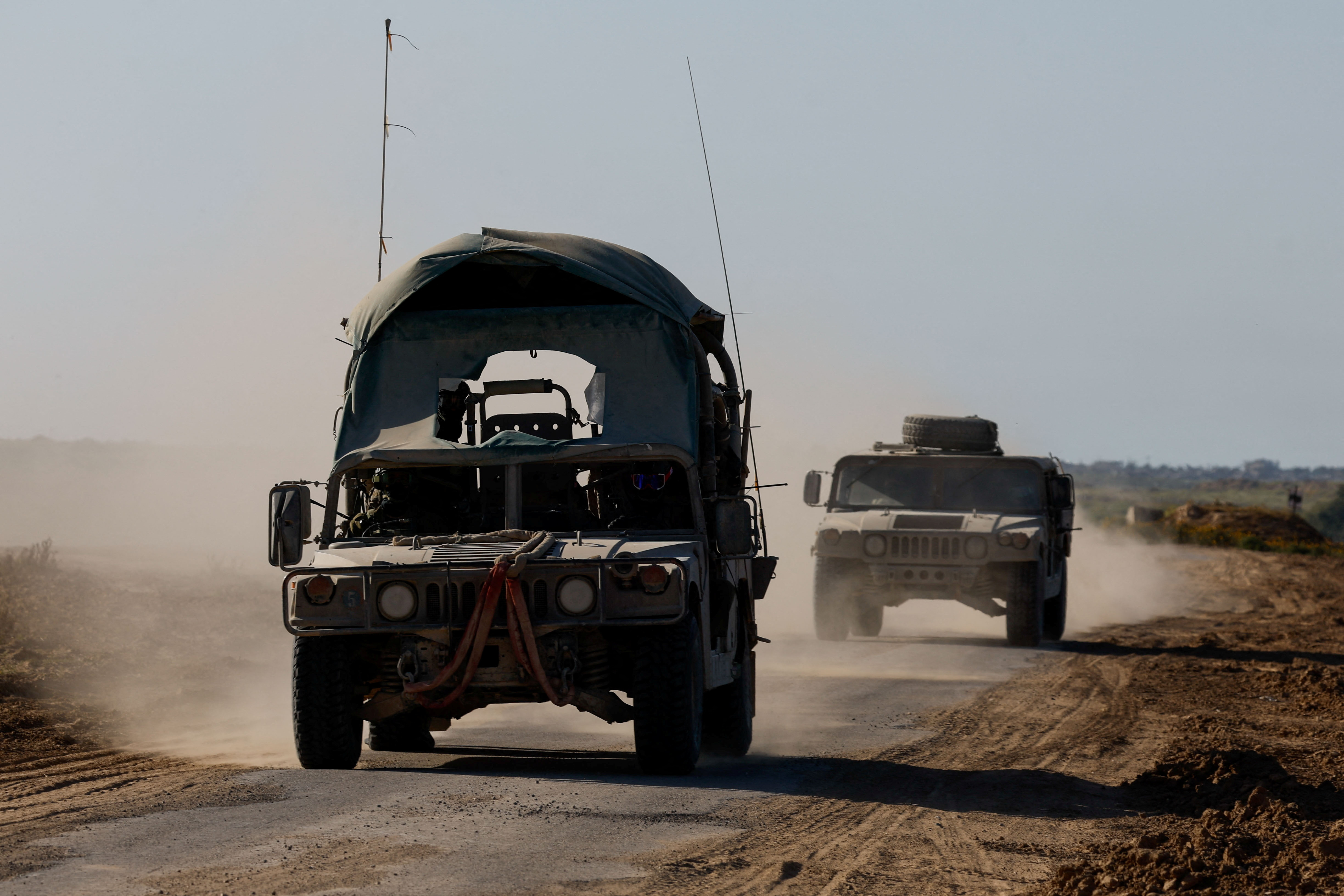 Israeli military vehicles manoeuvre near the Israel-Gaza border