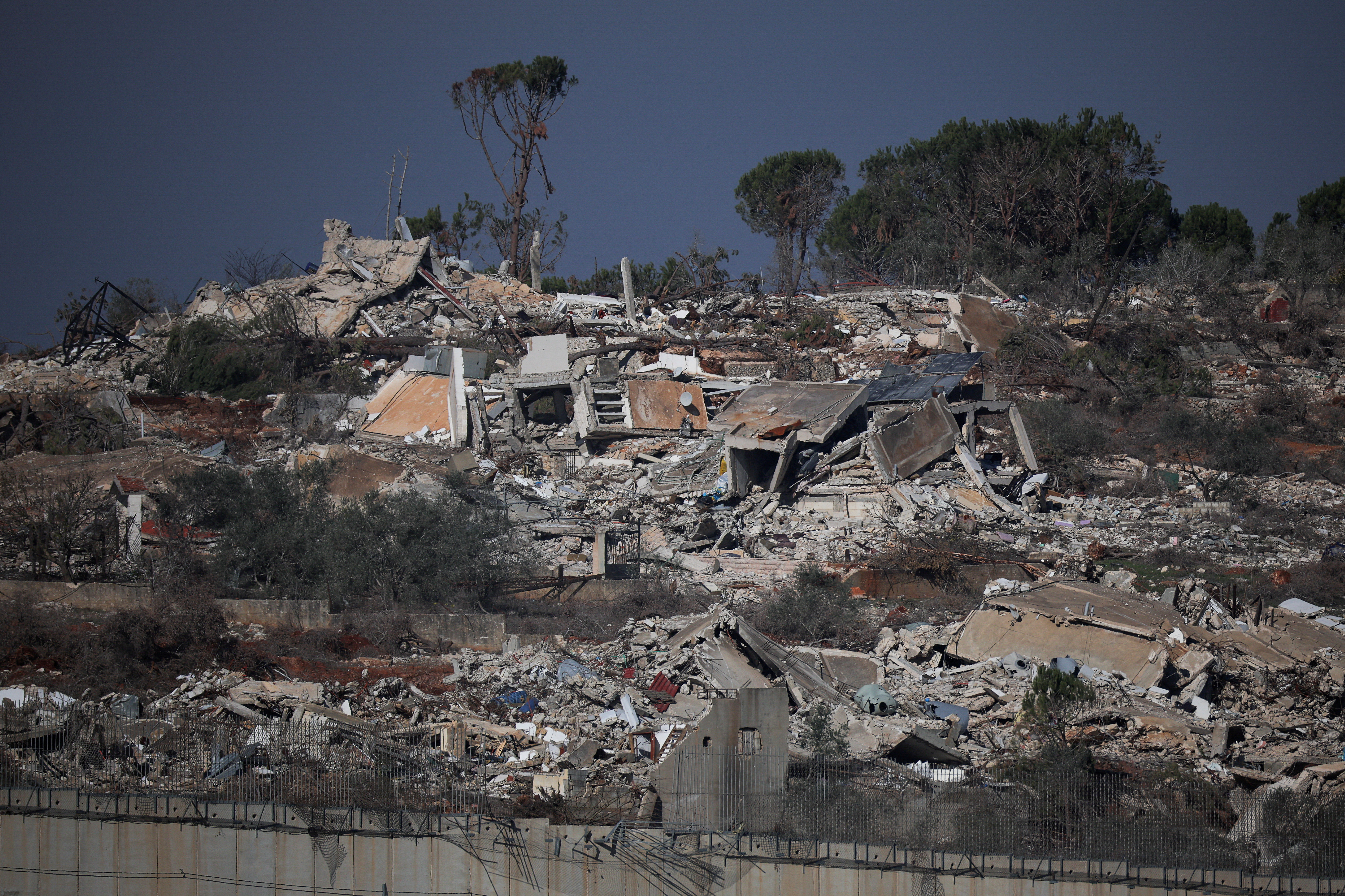 Buildings lie in ruin in Lebanon, as seen from Metula