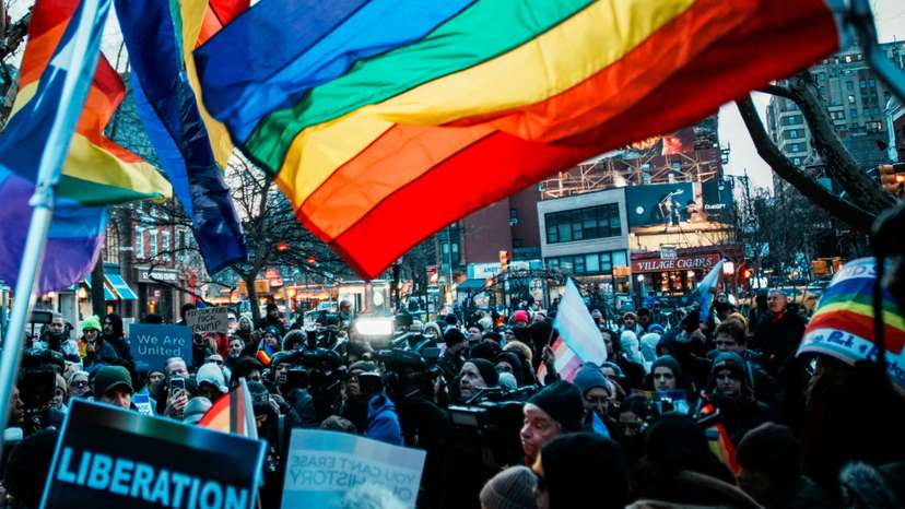 People gather at the Stonewall National Monument after authorities removed the Pride flag from the Greenwich Village site in New York