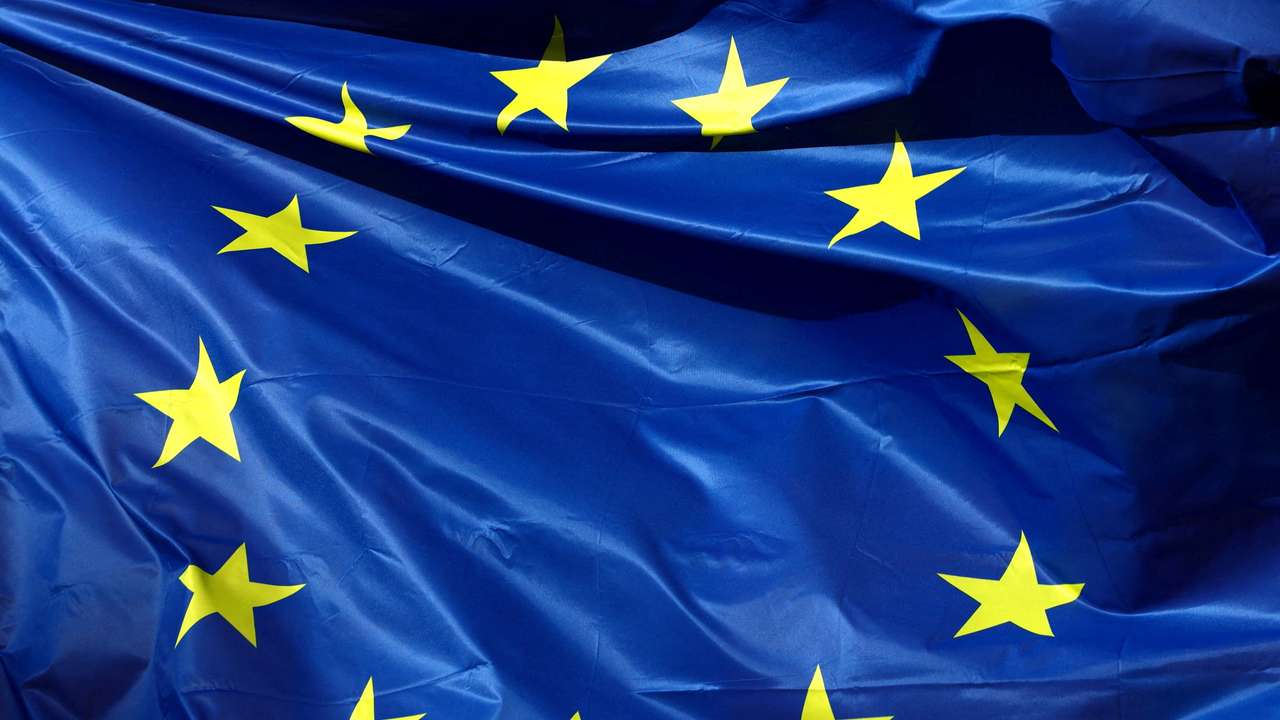 FILE PHOTO: A European Union flag flutters outside the EU Commission headquarters in Brussels