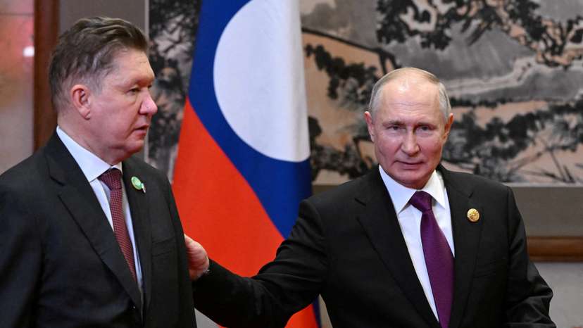FILE PHOTO: Russian President Vladimir Putin and Lao President Thongloun Sisoulith meet in Beijing