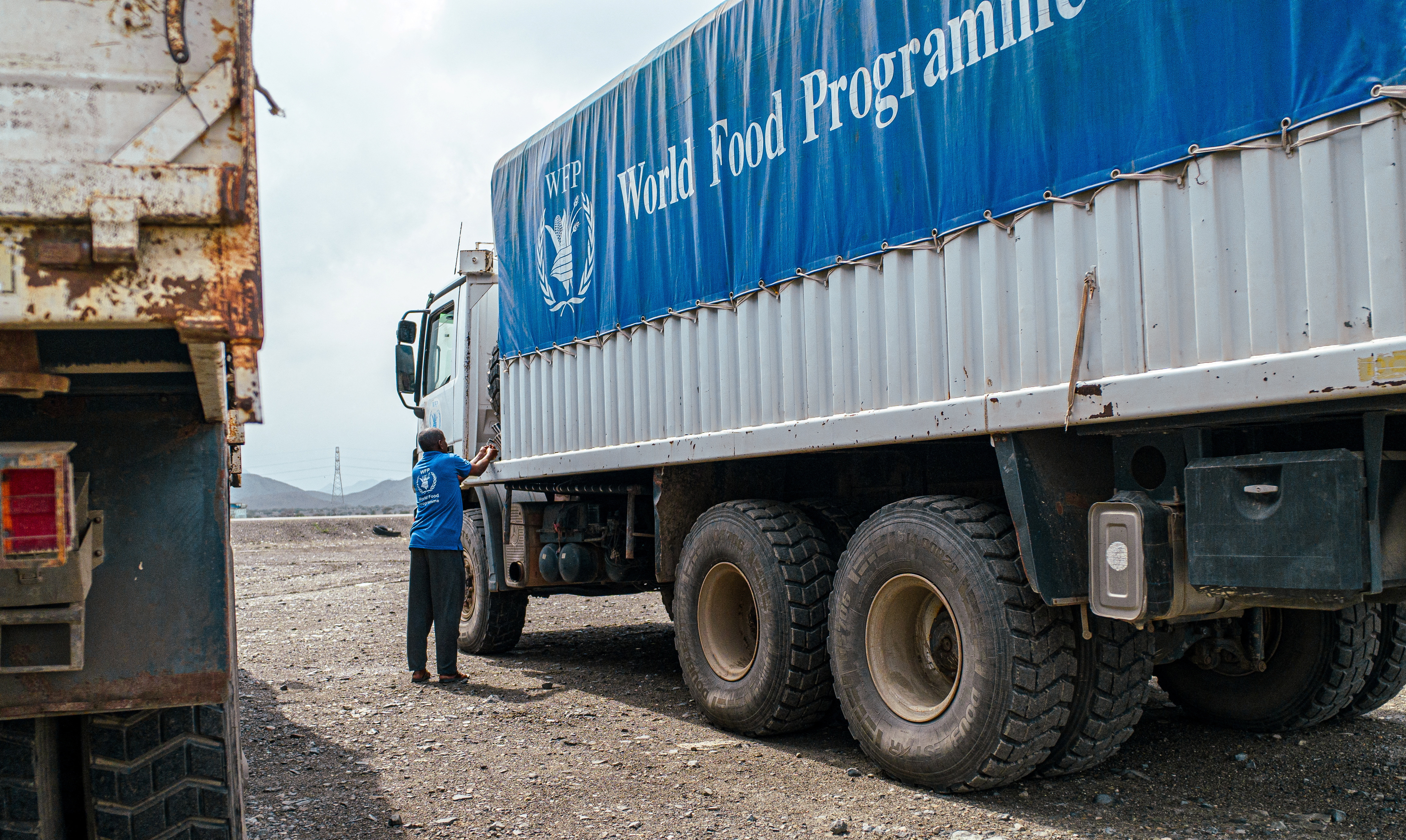 WFP trucks carry aid to Darfur and other famine-stricken parts through the Adre Border crossing