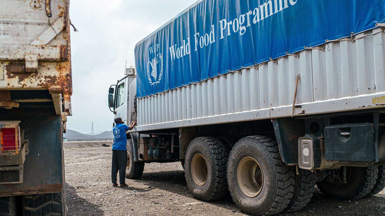 WFP trucks carry aid to Darfur and other famine-stricken parts through the Adre Border crossing