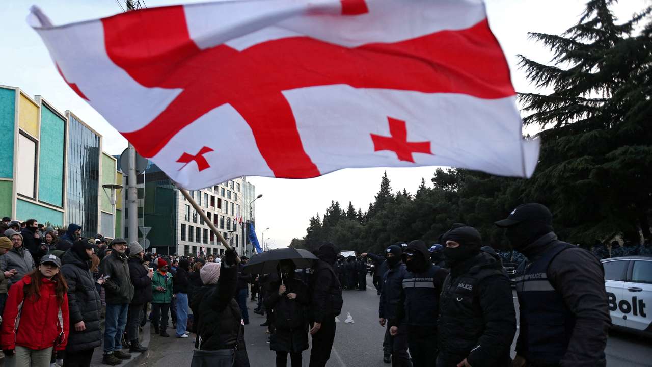 Georgian opposition supporters hold a rally in Tbilisi