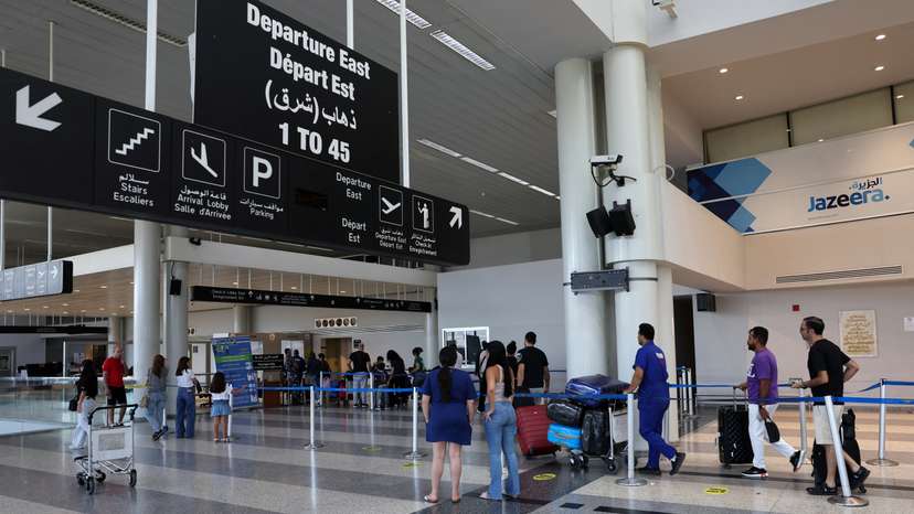 People push luggage at Beirut-Rafic Hariri International Airport
