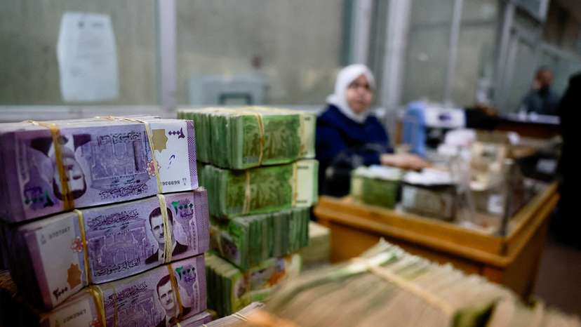 FILE PHOTO: Bundles of Syrian currency notes are stacked up at Syrian central bank in Damascus