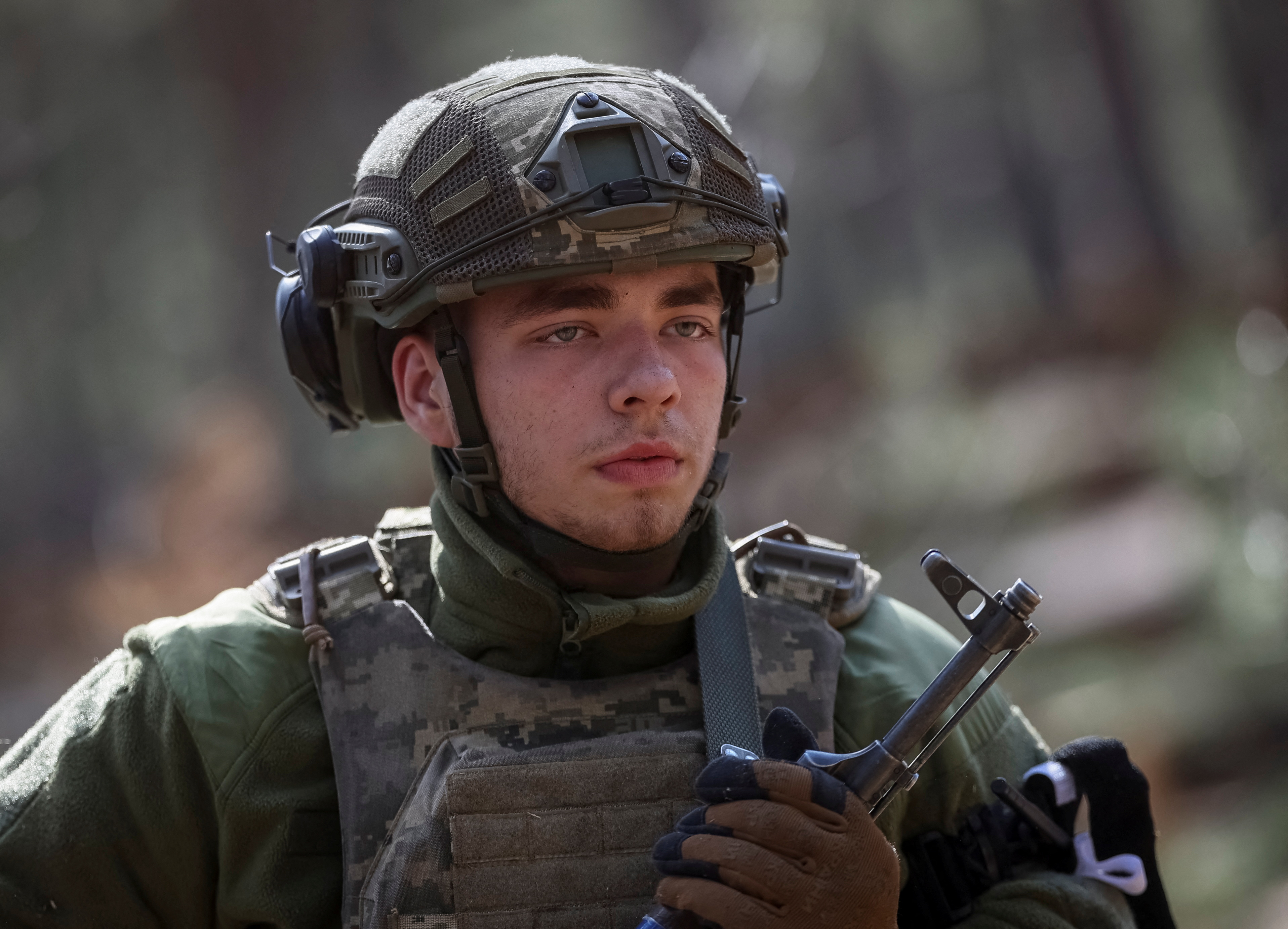 FILE PHOTO: Young recruits of the Ukrainian Armed Forces attend an exercise in Kyiv region