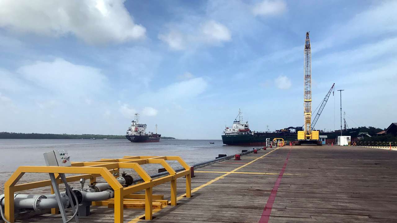 FILE PHOTO: Vessels carrying supplies for an offshore oil platform are seen, south of Georgetown, Guyana