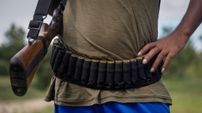 FILE PHOTO: An armed Kuki man stands at a checkpoint at Kangvai village in Churachandpur district