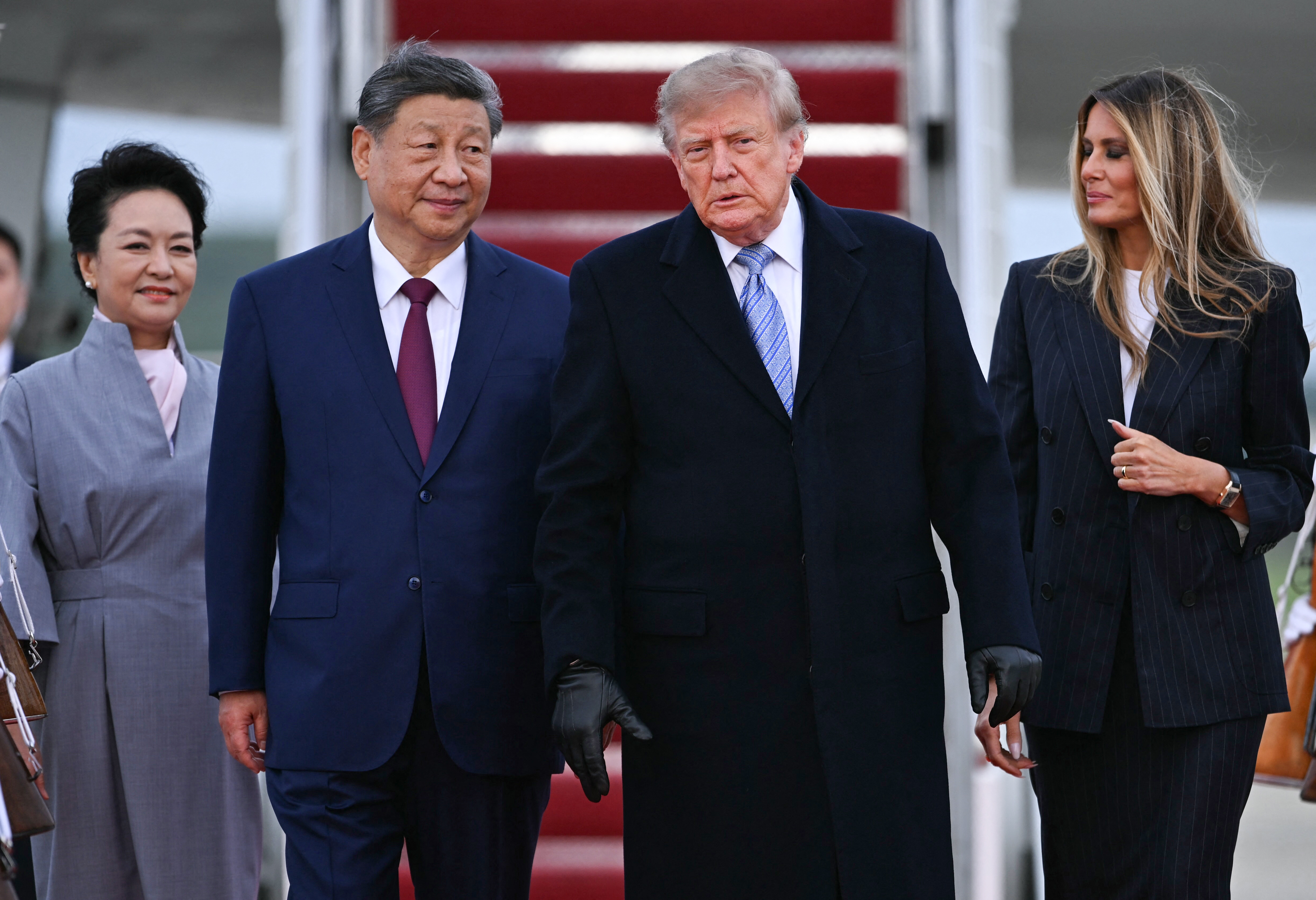 US President Donald Trump and US First Lady Melania Trump greet Chinese President Xi Jinping and China’s First Lady Peng Liyuan upon their arrival at Joint Base Andrews in Maryland on September 23, 2026.