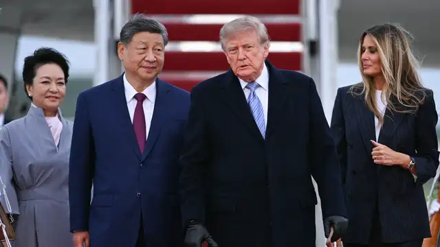 US President Donald Trump and US First Lady Melania Trump greet Chinese President Xi Jinping and China’s First Lady Peng Liyuan upon their arrival at Joint Base Andrews in Maryland on September 23, 2026.