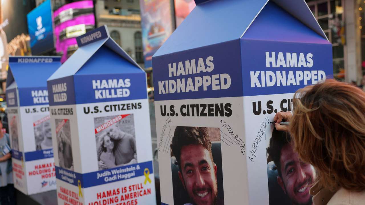 A person writes 'Murdered!' on a mock milk carton with the face of U.S. citizen Hersh Goldberg-Polin, who was kidnapped in the October 7 attack in Israel, in New York City