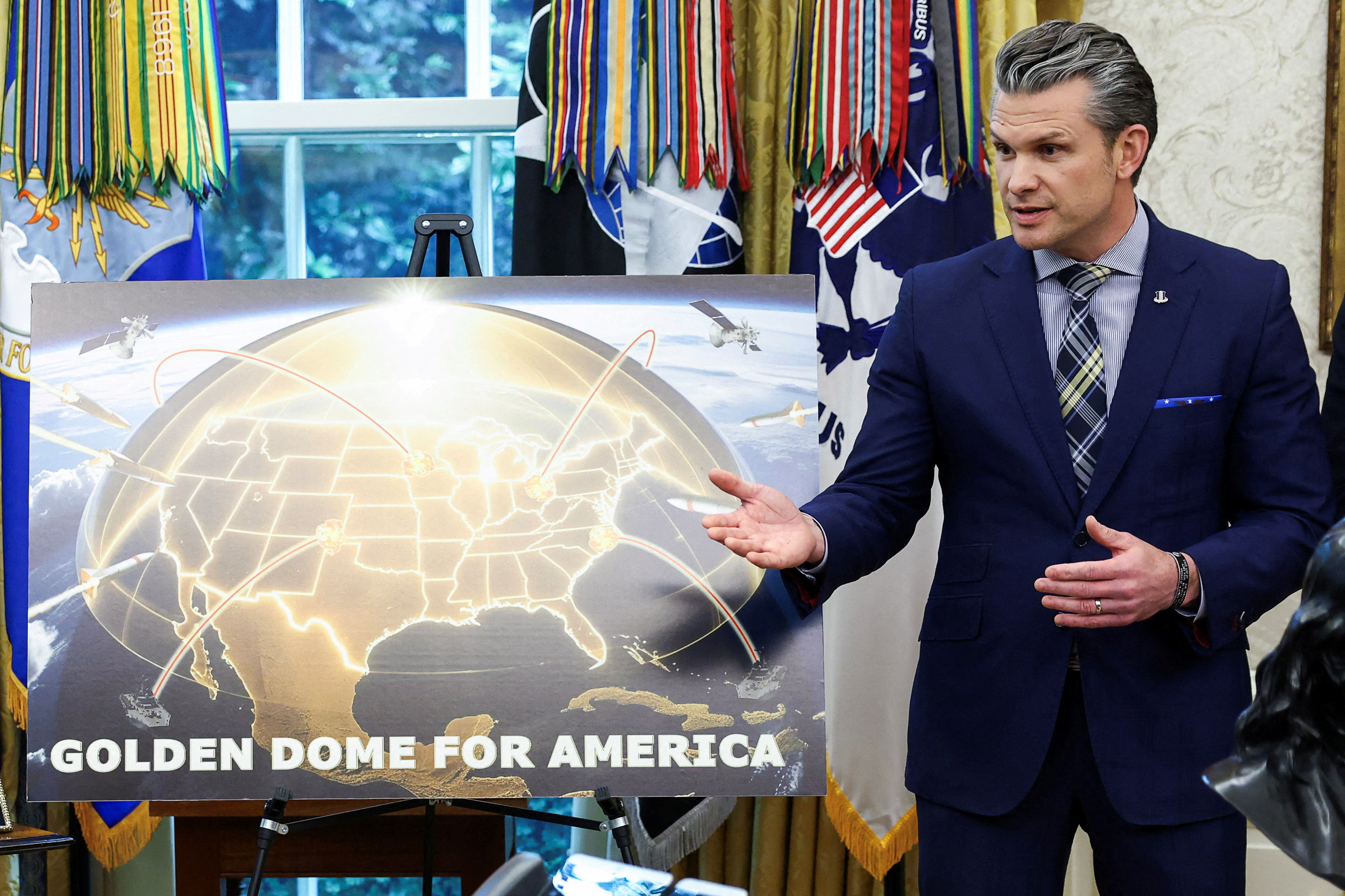 FILE PHOTO: U.S. Defense Secretary Pete Hegseth speaks about Golden Dome in the White House