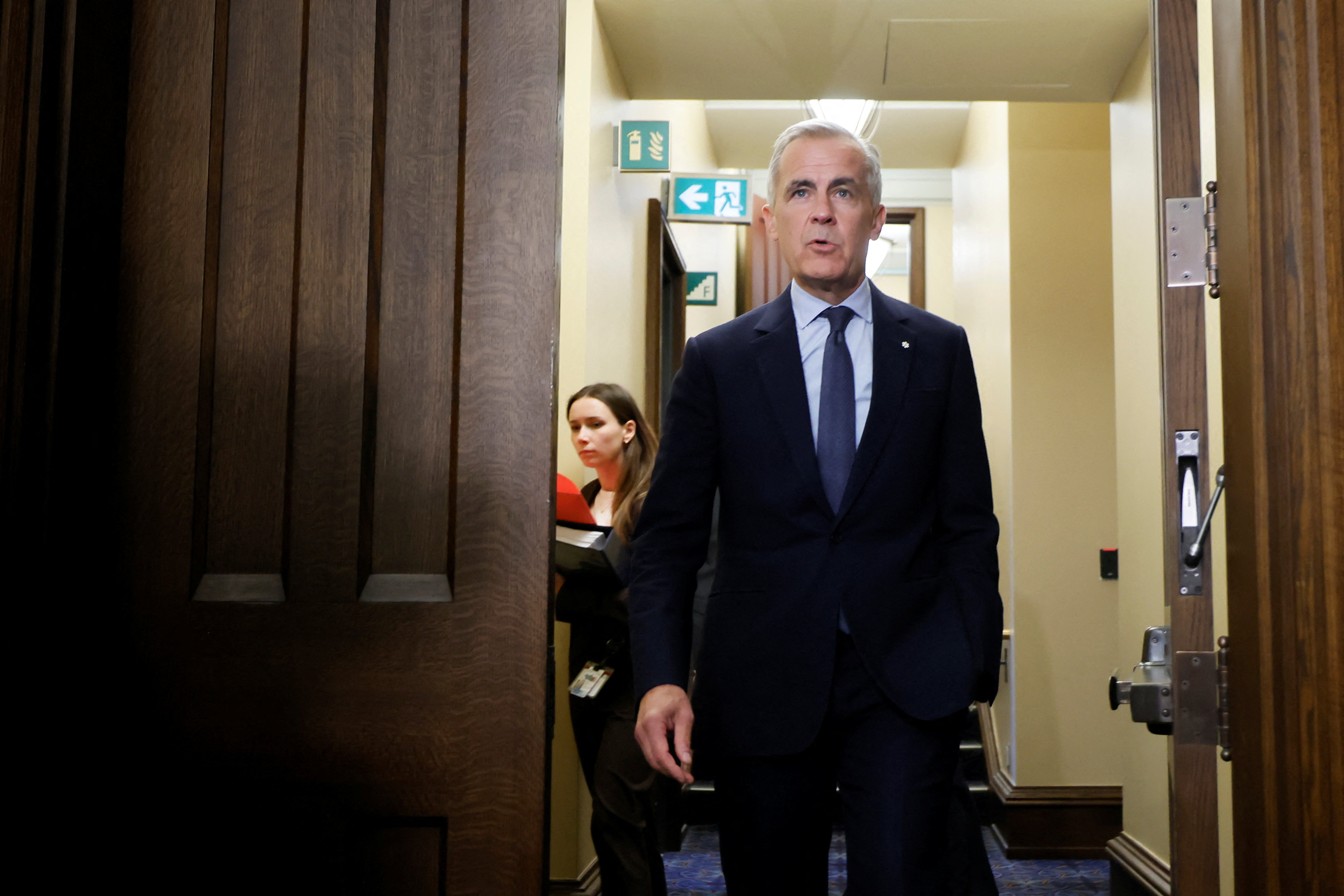 Canada's Prime Minister Mark Carney walks to the House of Commons for Question Period on Parliament Hill in Ottawa