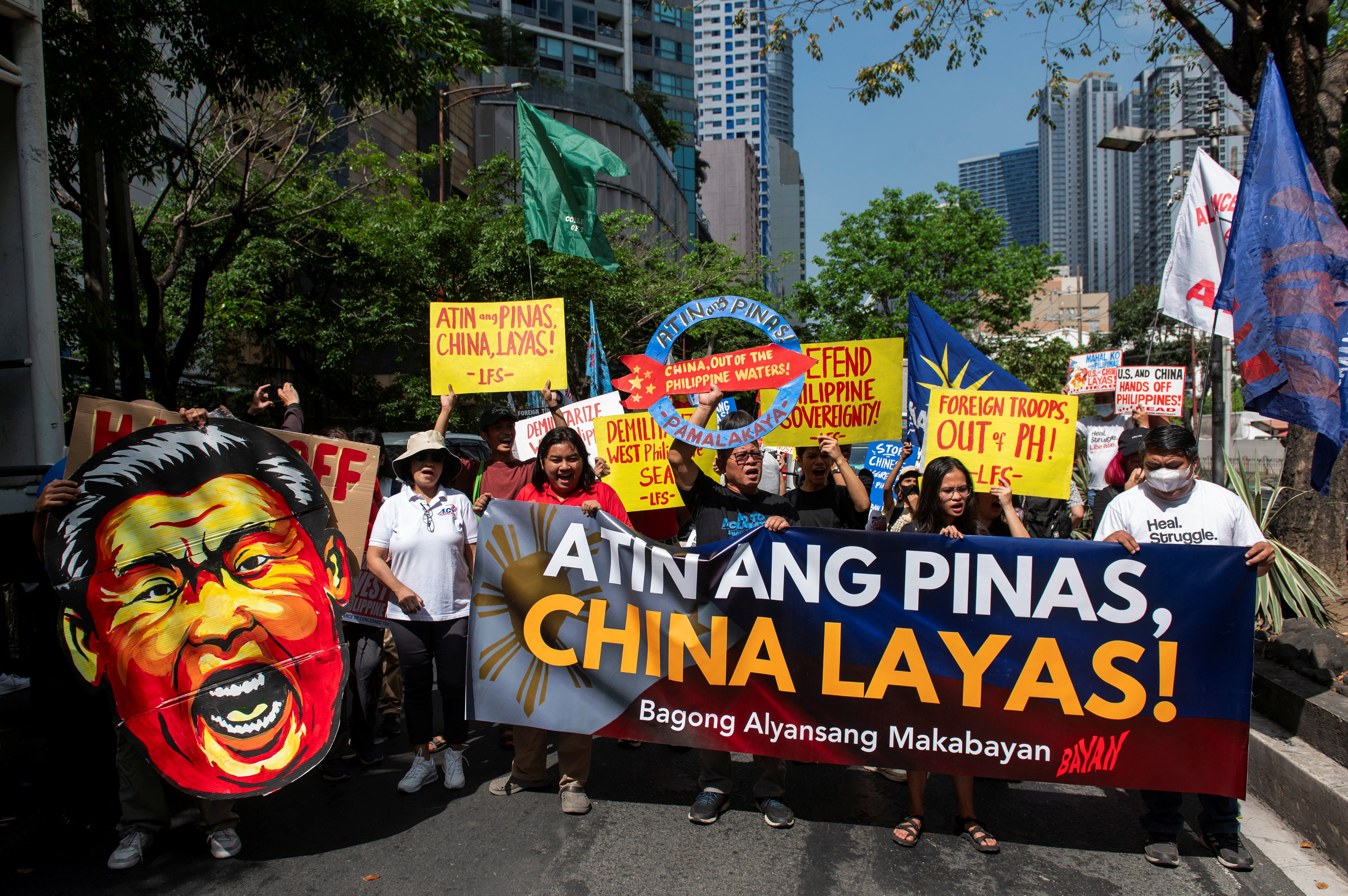 Filipino protesters hold a protest outside of Chinese Consulate in Makati, Philippines