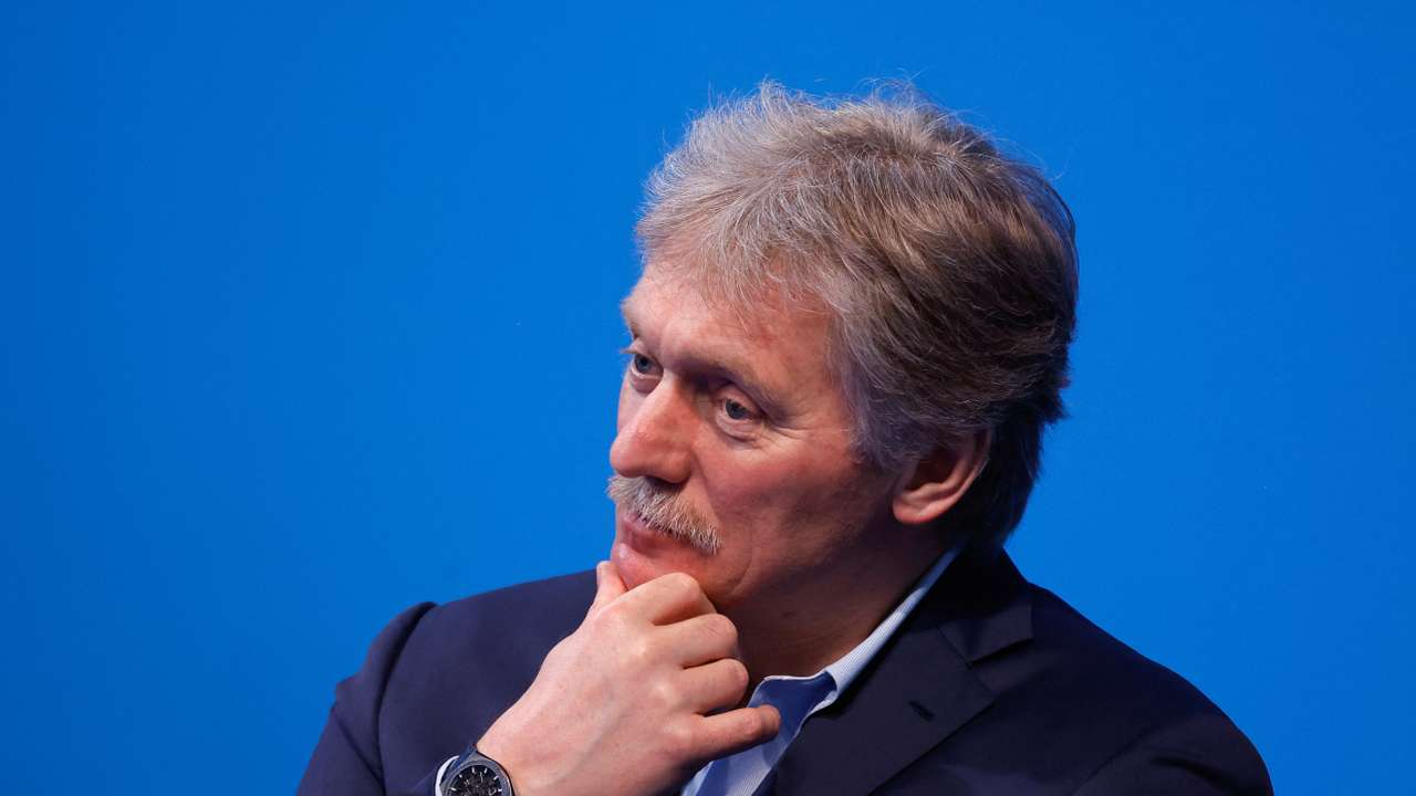 Kremlin spokesman Peskov listens as Russian incumbent President Putin speaks, in Moscow