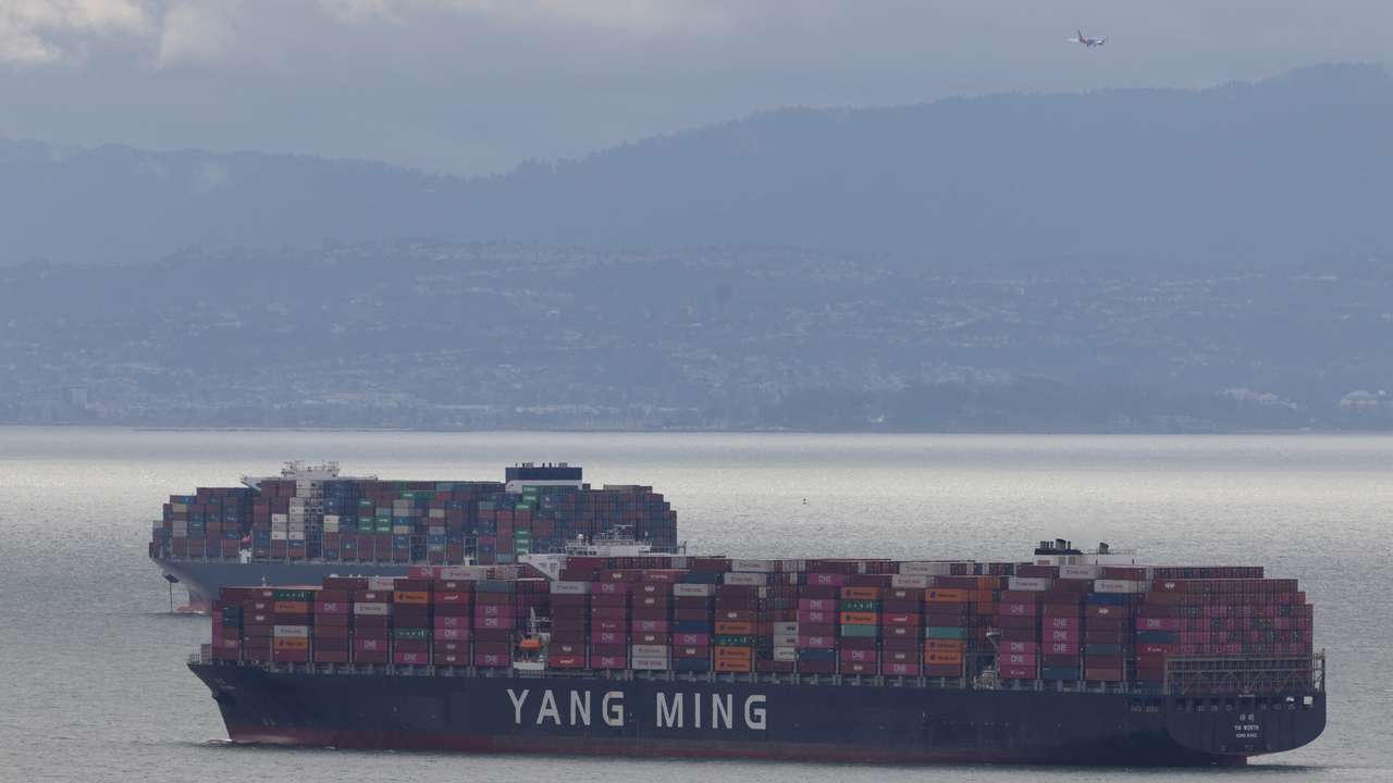 FILE PHOTO: Cargo ships full of shipping containers are seen at the port of Oakland as trade tensions escalate over U.S. tariffs