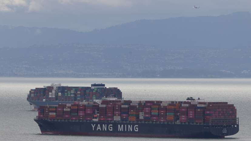FILE PHOTO: Cargo ships full of shipping containers are seen at the port of Oakland as trade tensions escalate over U.S. tariffs