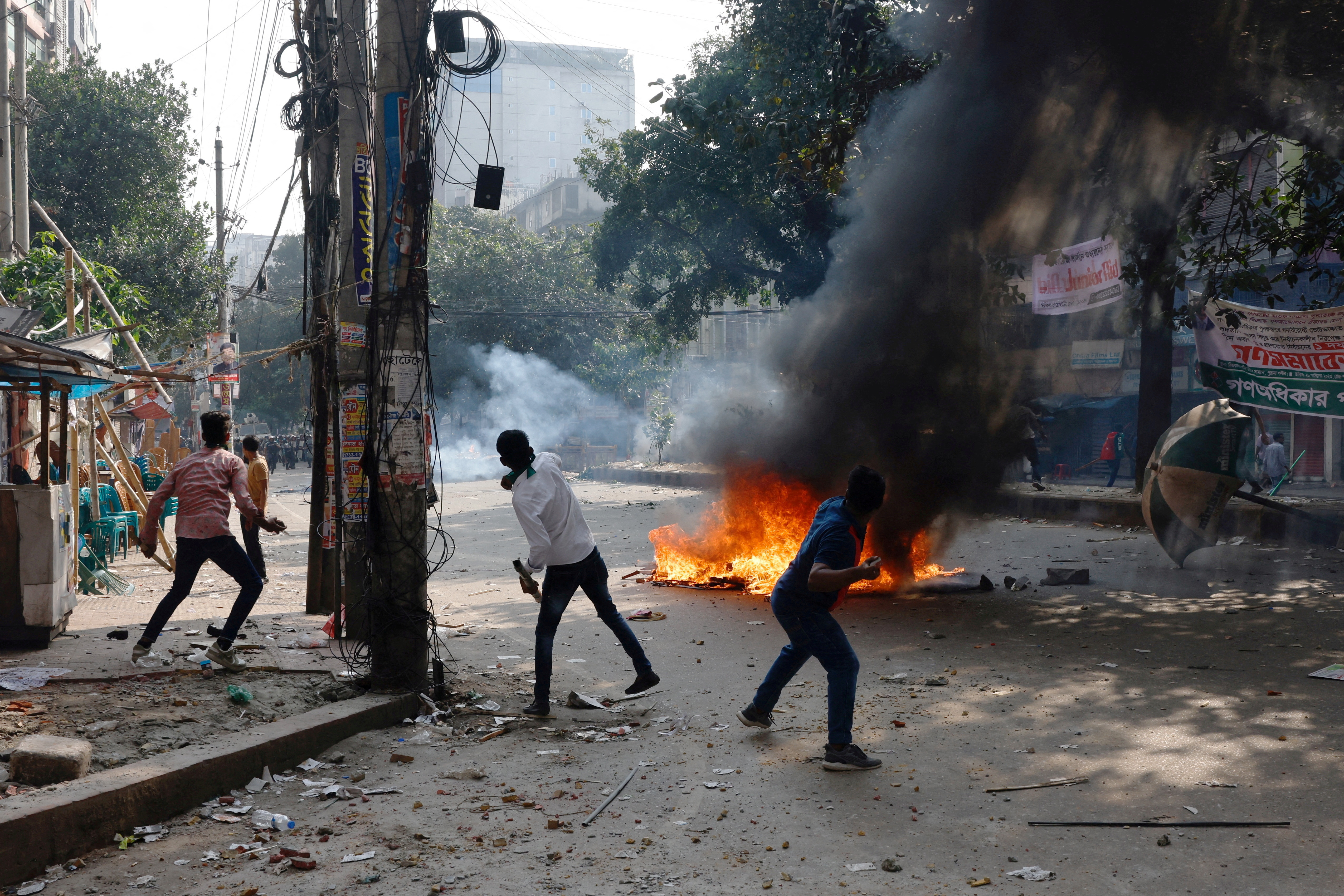 FILE PHOTO: Supporters of Bangladesh Nationalist Party (BNP) throw brickbats towards police during a clash in Dhaka