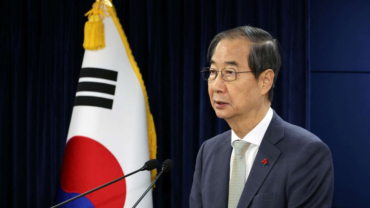 Acting South Korean President and Prime Minister Han Duck-soo delivers an address to the nation at the government complex in Seoul