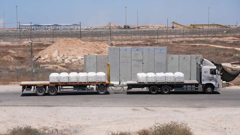 A truck carrying aid for delivery into Gaza drives through the Kerem Shalom crossing in southern Israel