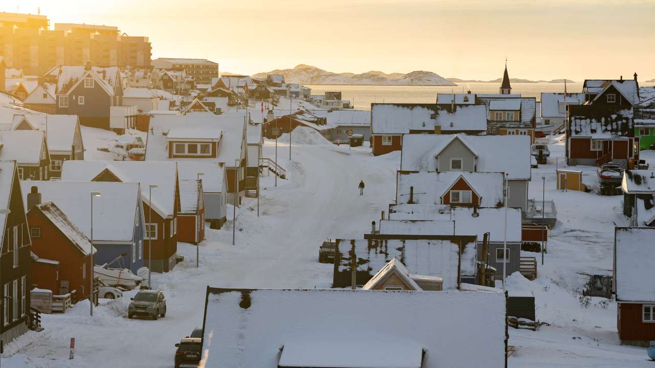 A person walks along a street on the day of the meeting between top U.S. officials and the foreign ministers of Denmark and Greenland, in Nuuk