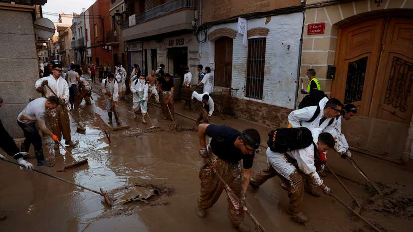 FILE PHOTO: Volunteers continue cleaning up following floods in Valencia