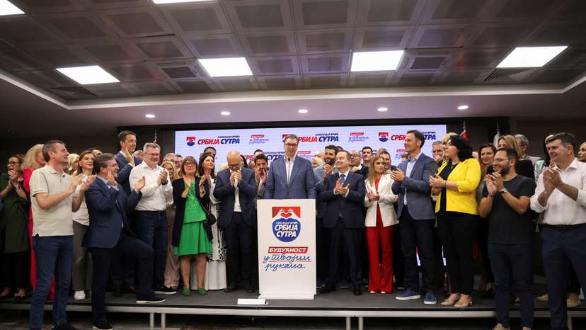 Serbian President Aleksandar Vucic speak on stage at Serbian Progressive Party (SNS) headquarters following exit polls