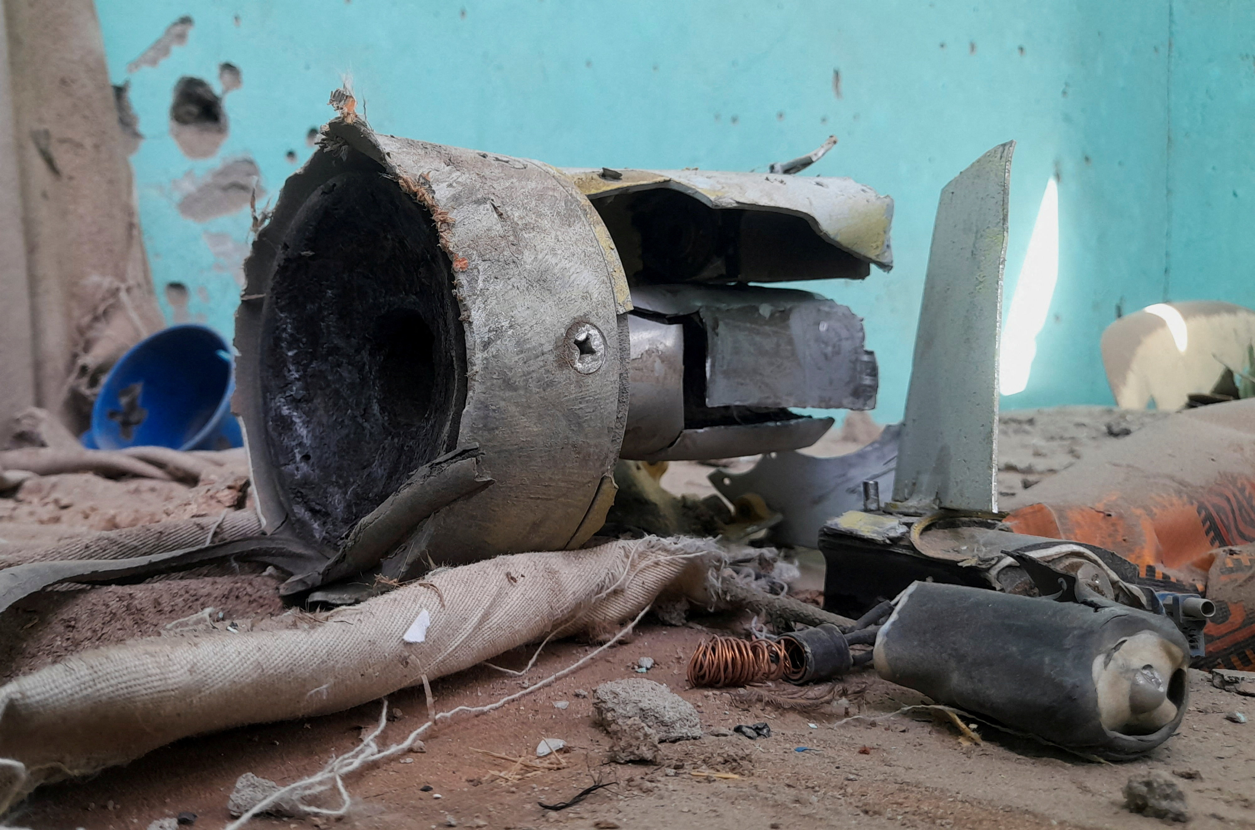 Remnants of a shell that targeted the refugee center, in El Fasher