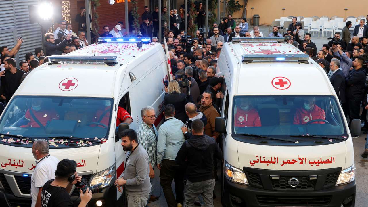 Ambulances carrying the bodies of the two journalists of Lebanon-based Al Mayadeen TV channel are parked outside the channel's building in Beirut