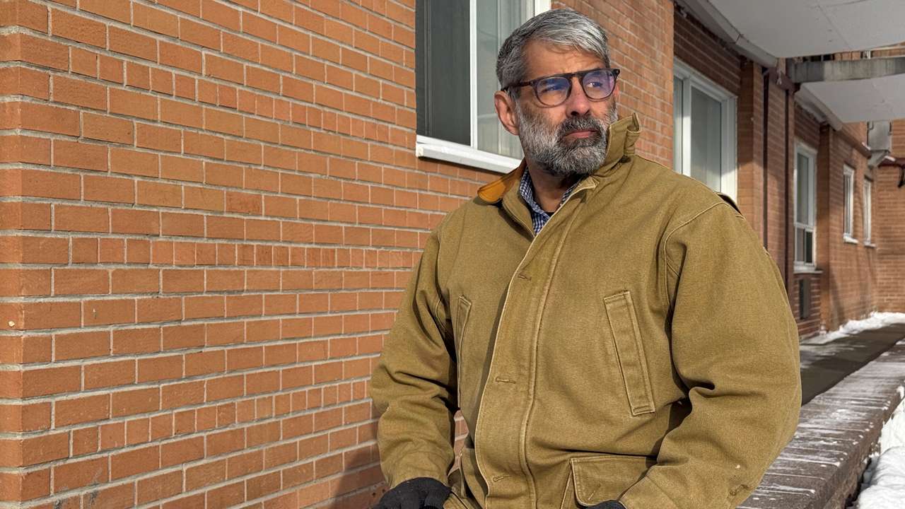 Venezuelan engineer Luis Cabana poses near his apartment in Ottawa
