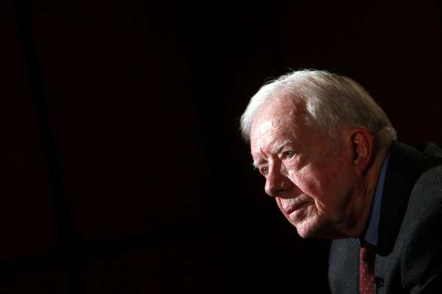 FILE PHOTO: Former U.S. President Jimmy Carter attends an interview with Reuters in Cairo