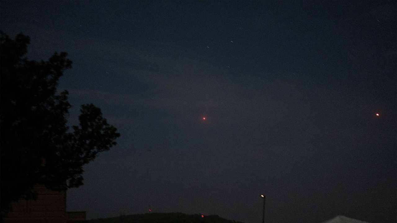 India's air defence system intercepts objects in the sky during a blackout following multiple blasts in the city of Jammu