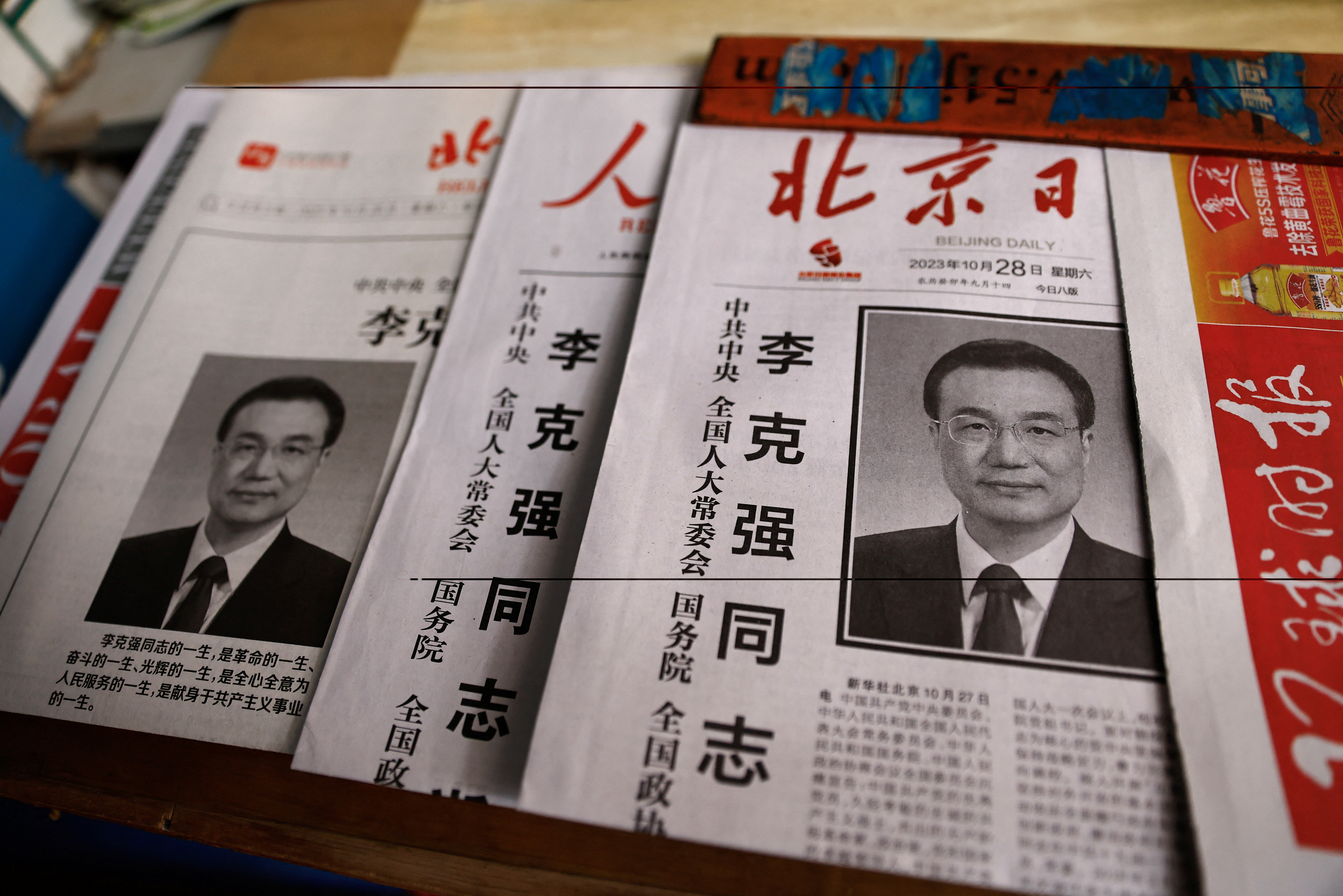 Newspapers with the obituary of late former Chinese Premier Li Keqiang on the frontpage are displayed, at a newsstand in Beijing