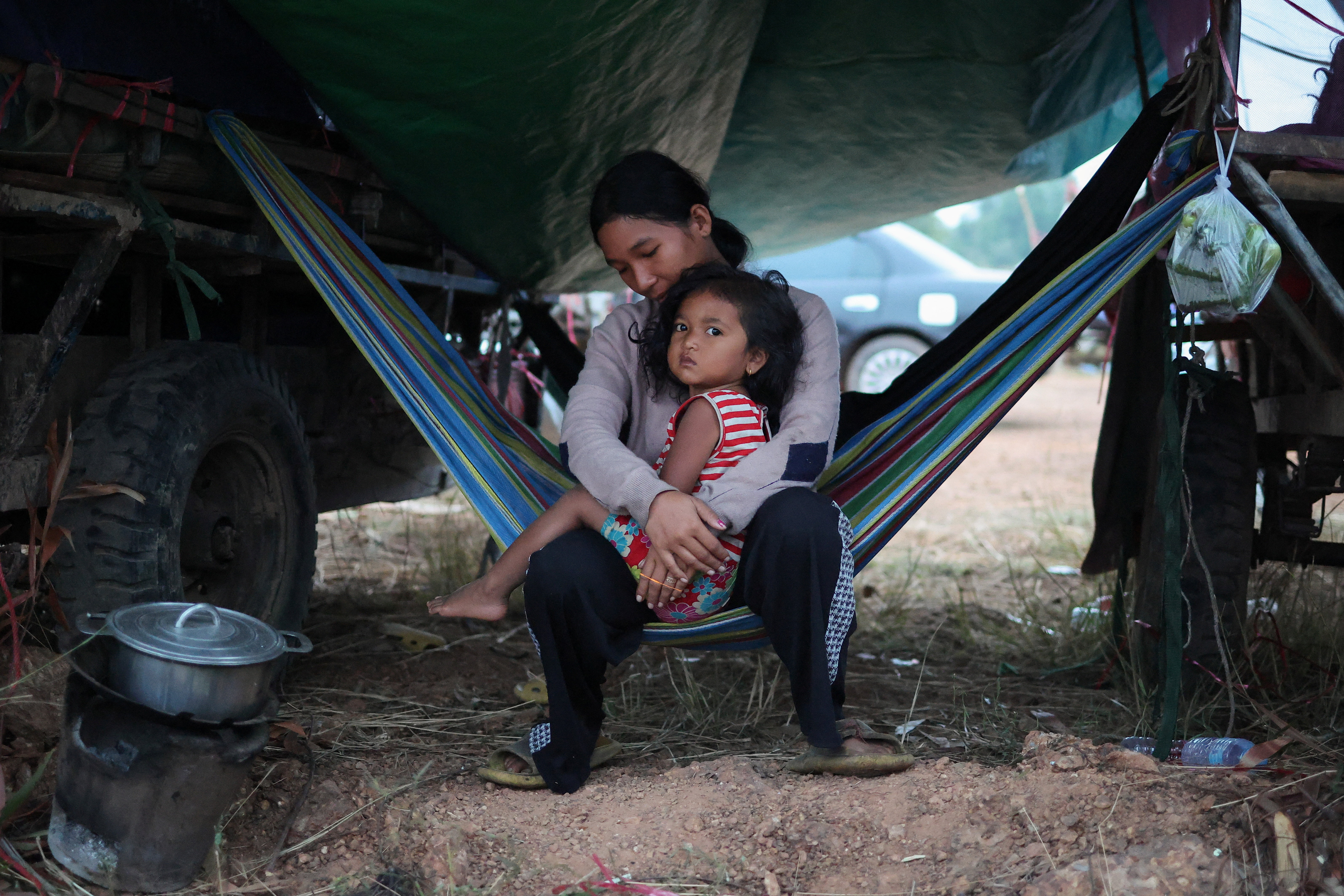 People gather at a refugee camp after evacuation, in Srei Snam