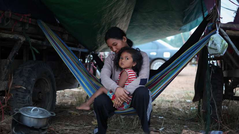People gather at a refugee camp after evacuation, in Srei Snam