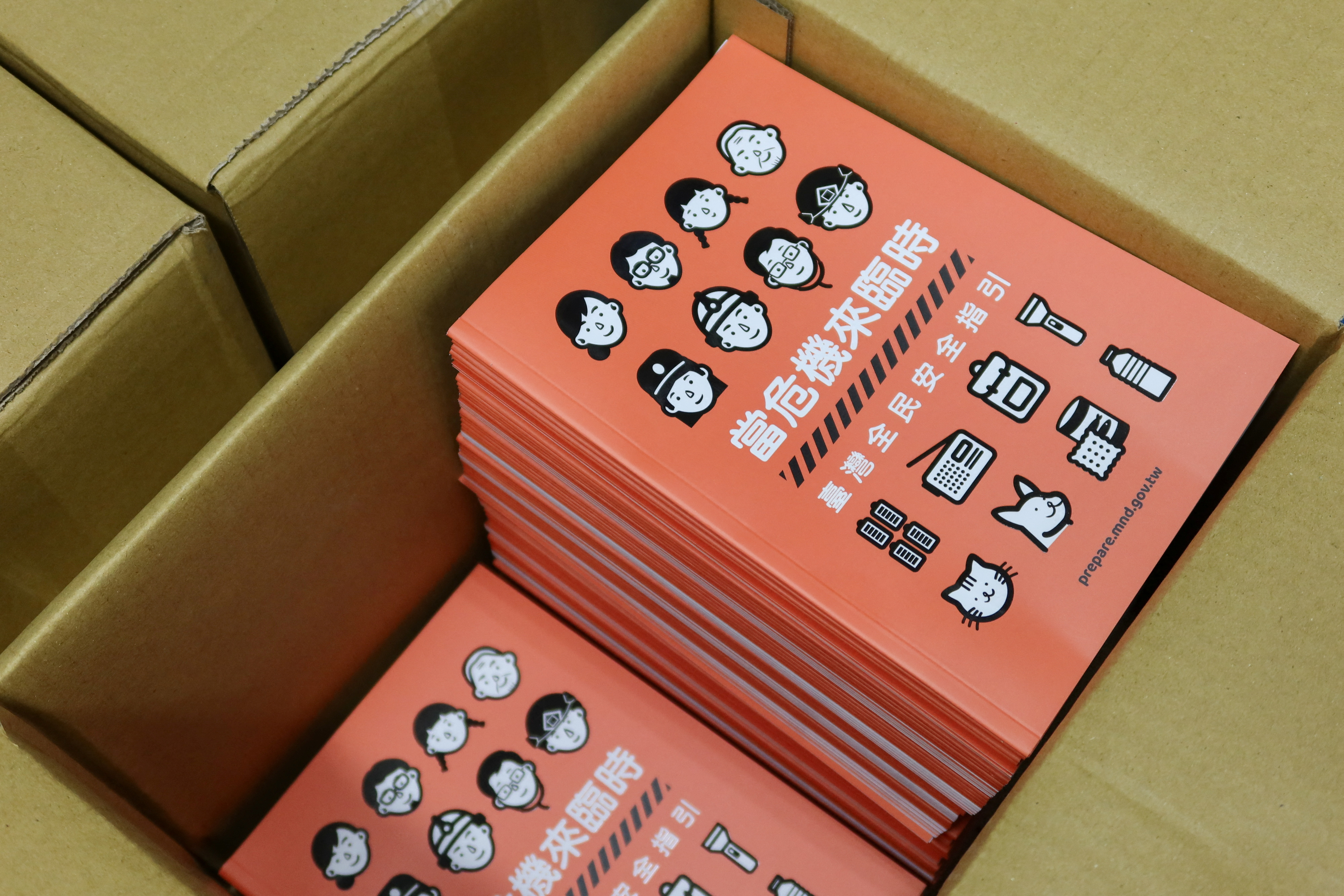 Copies of Taiwan's updated civil defence handbook are seen at a printing house in Taoyuan